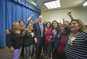 September 26, 2013 Domestic workers and Governor Brown cheering after he signed AB 241 into law.
